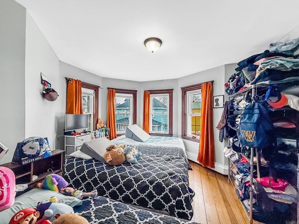 19 Moore Street Winthrop, MA 02152 - Photo 33 of 42 a living room with furniture and a floor to ceiling window