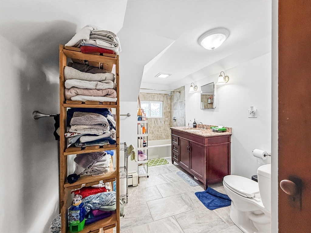 19 Moore Street Winthrop, MA 02152 - Photo 40 of 42 a bathroom with a toilet sink and double vanity