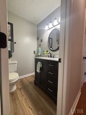 a bathroom with a toilet a sink and a mirror