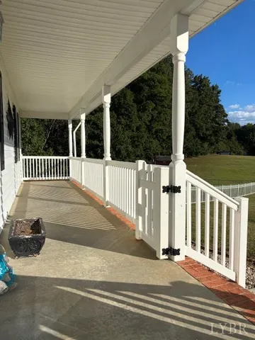 a view of a porch with wooden floor