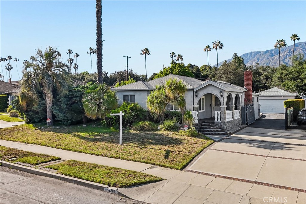 2209 Queensberry Road Pasadena, CA 91104 - Photo 1 of 44 a front view of a house with garden