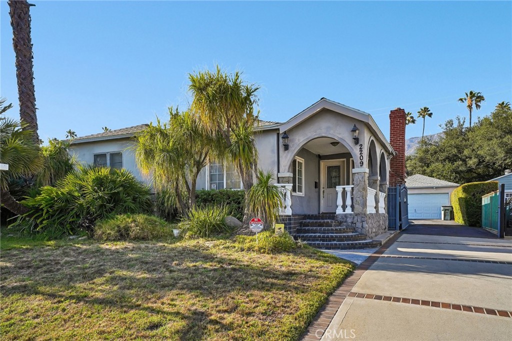 2209 Queensberry Road Pasadena, CA 91104 - Photo 2 of 44 a front view of a house with a yard