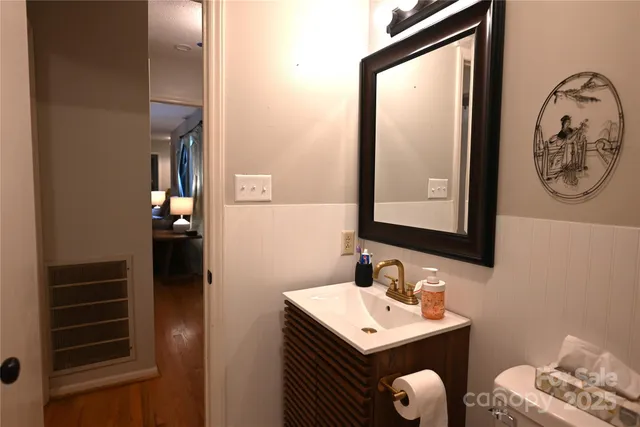 a bathroom with a sink vanity and a mirror