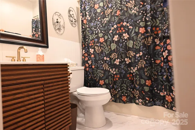 a bathroom with a toilet and a sink