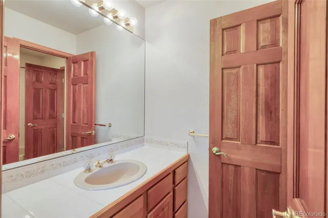 a bathroom with a sink and a mirror