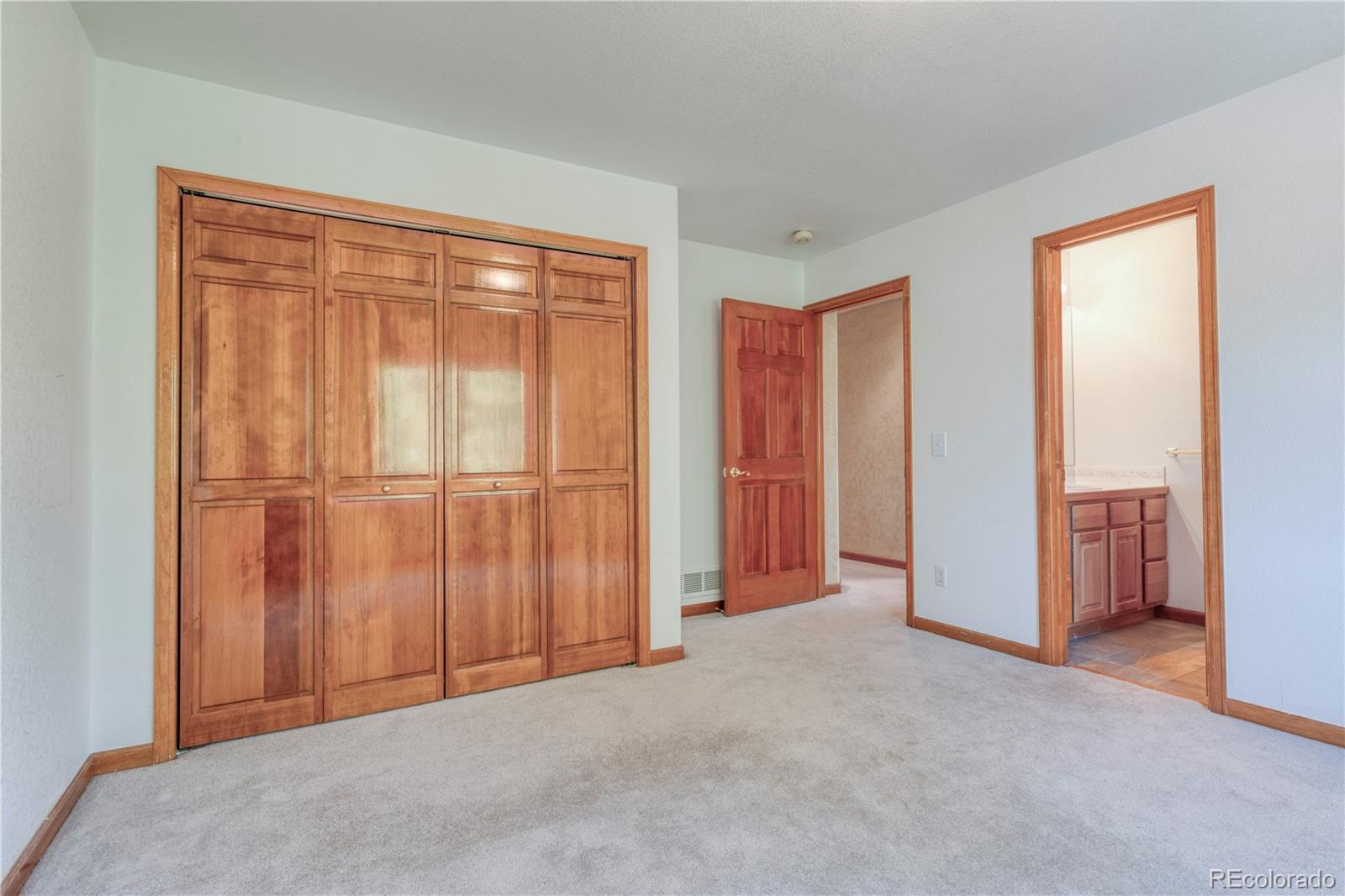 3756 West 100th Avenue Westminster, CO 80031 - Photo 22 of 45 a view of an empty room with a window