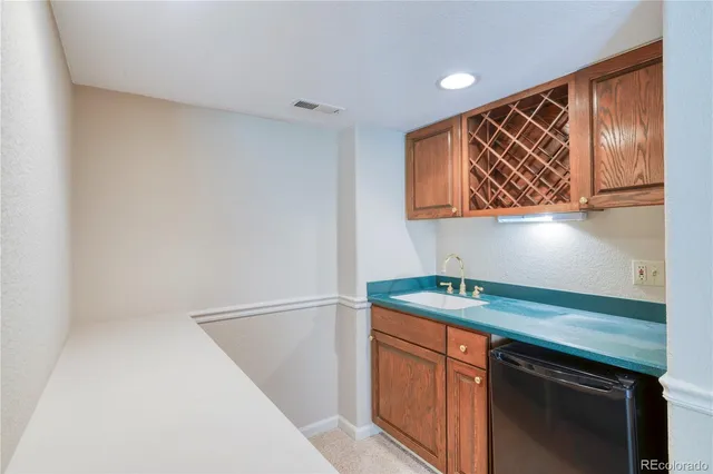 a kitchen with stainless steel appliances granite countertop a sink and a microwave