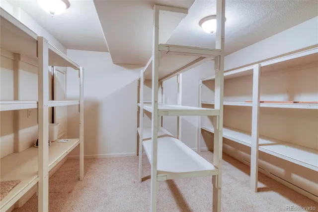 a view of a hallway with seating area