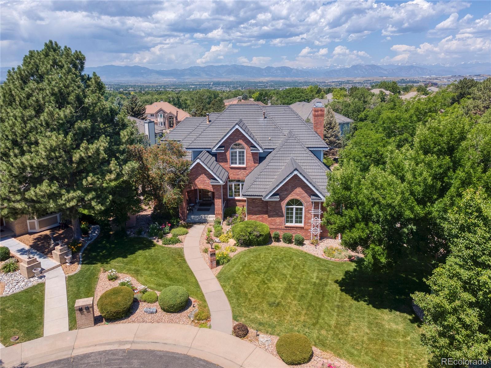 3756 West 100th Avenue Westminster, CO 80031 - Photo 41 of 45 front view of a house with a yard