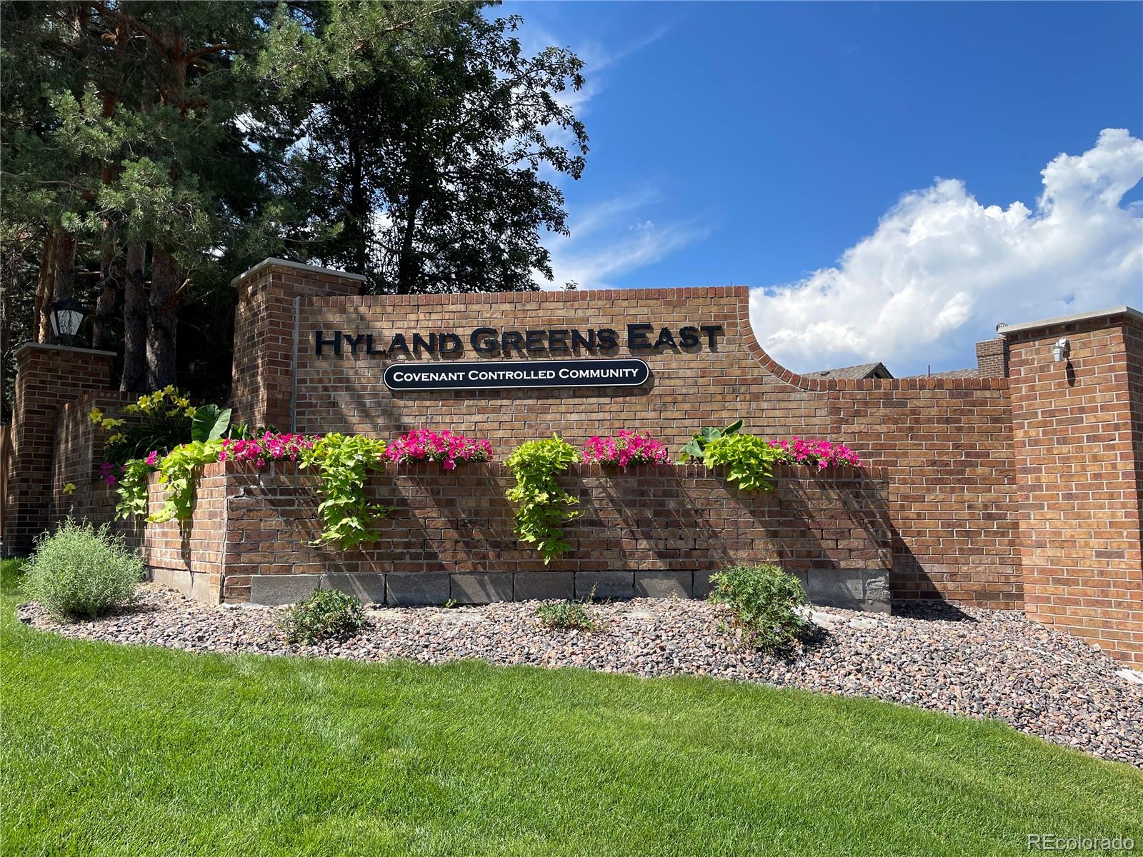 3756 West 100th Avenue Westminster, CO 80031 - Photo 42 of 45 a front view of a house with a garden