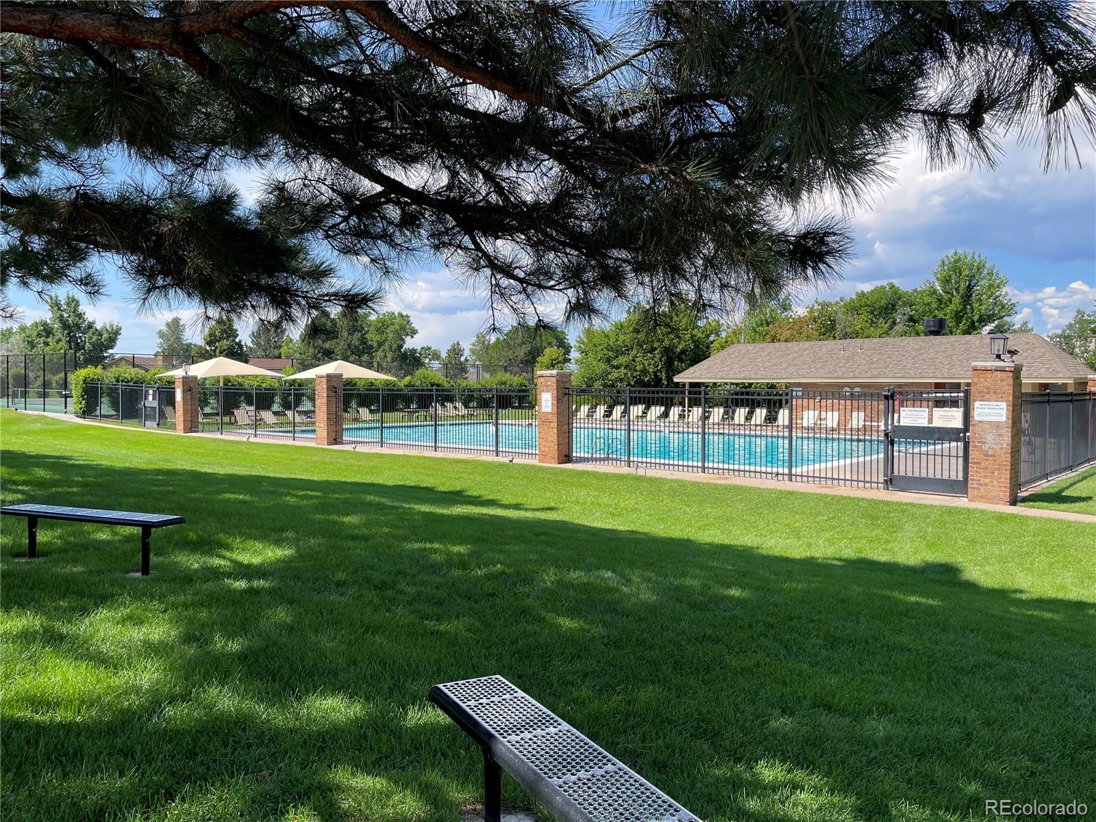 3756 West 100th Avenue Westminster, CO 80031 - Photo 43 of 45 a view of a garden with a bench