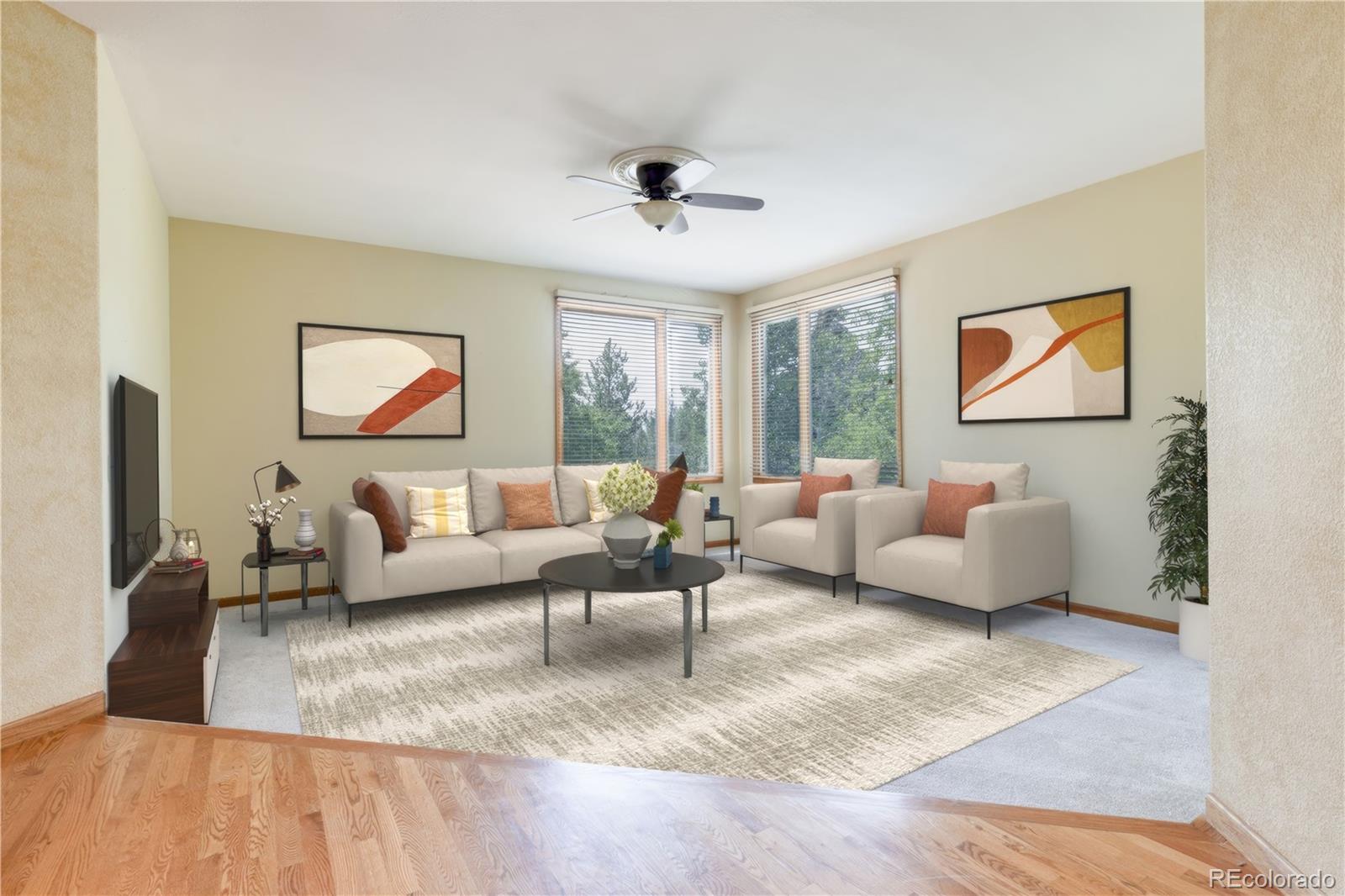 3756 West 100th Avenue Westminster, CO 80031 - Photo 6 of 45 a living room with furniture and a flat screen tv