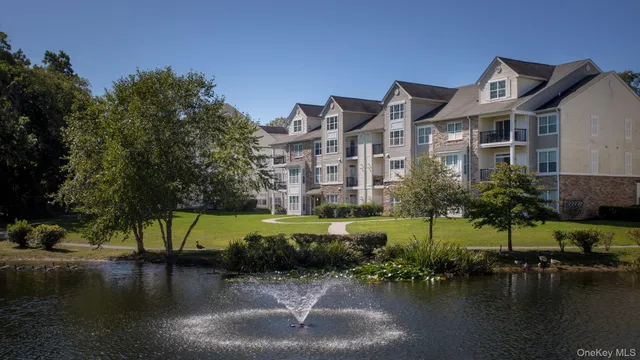 a view of a lake with a building in the background