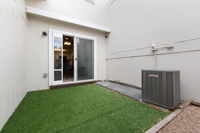 a view of a backyard with wooden fence