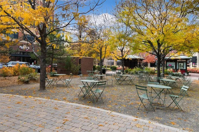 a view of a building with sitting area