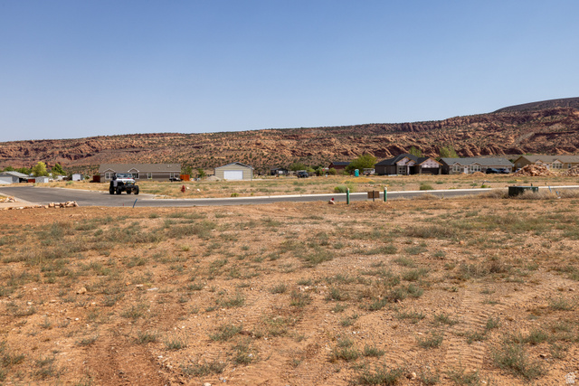 212 Lidia Circle, Unit 17 Moab, UT 84532 - Photo 19 of 24 Expansive desert lot featuring a clear, level building area and visible utilities