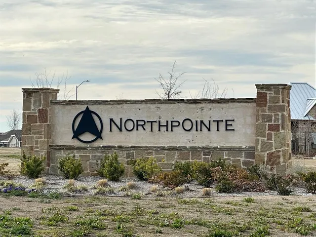 a view of swimming pool with seating area