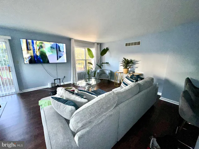 a kitchen with a sink a stove and cabinets