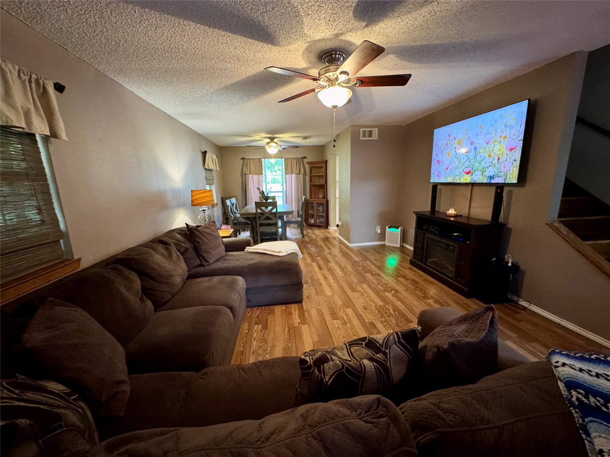 954 Hillbilly Heaven Road Livingston, TX 77351 - Photo 13 of 37 a living room with furniture and a flat screen tv