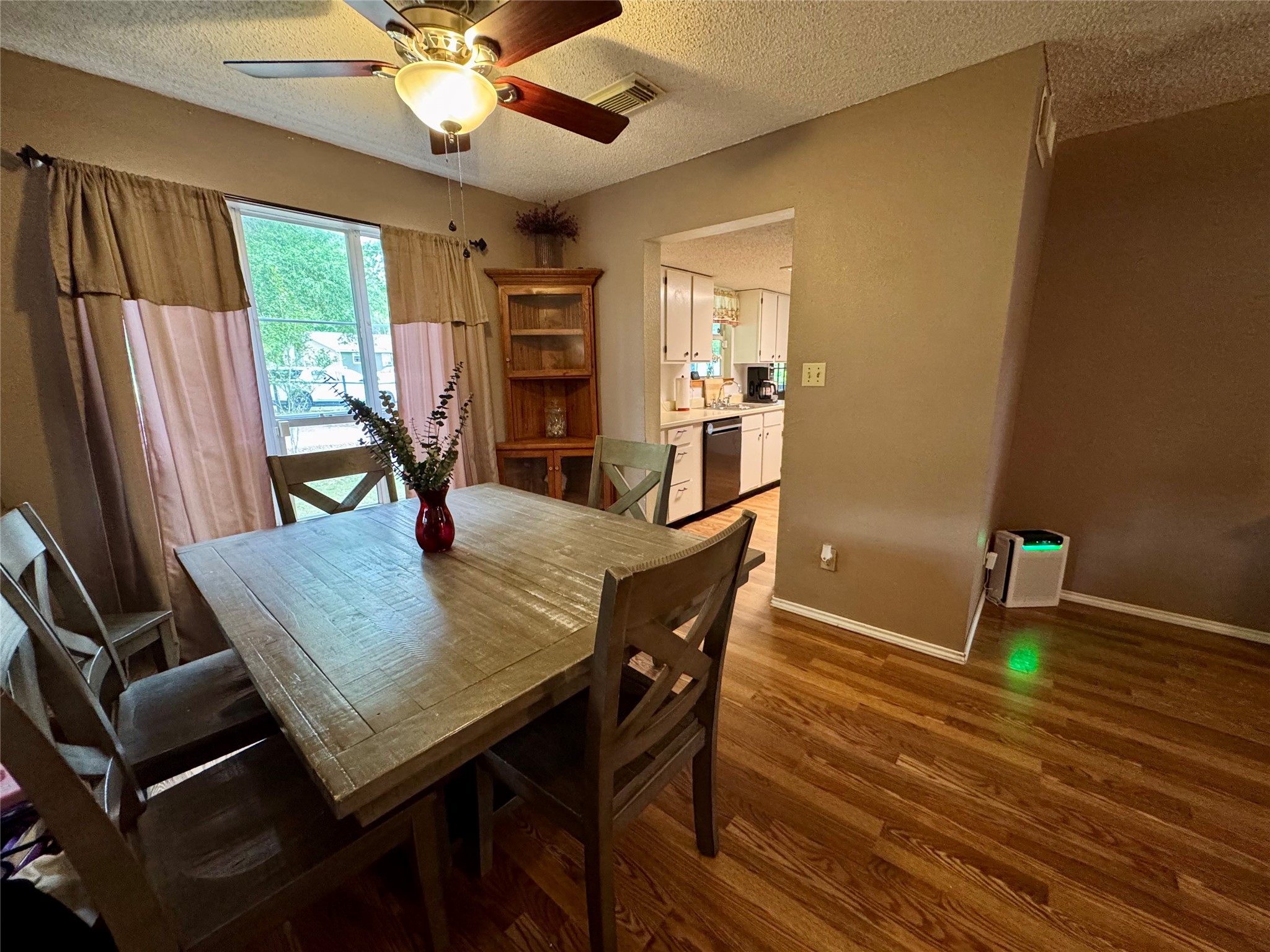 954 Hillbilly Heaven Road Livingston, TX 77351 - Photo 18 of 37 a view of a dining room with furniture window and wooden floor