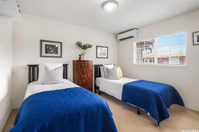 a bedroom with bed and a window