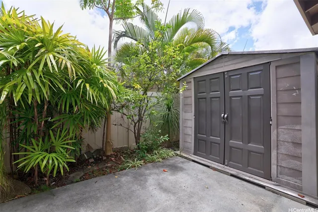 a house with a plant in front of it