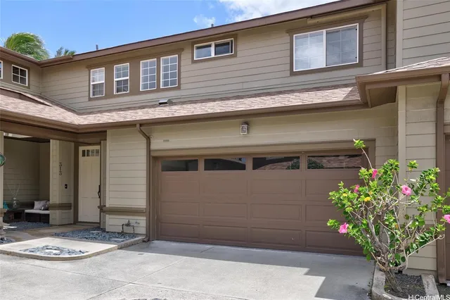 a view of swimming pool with a yard and palm trees