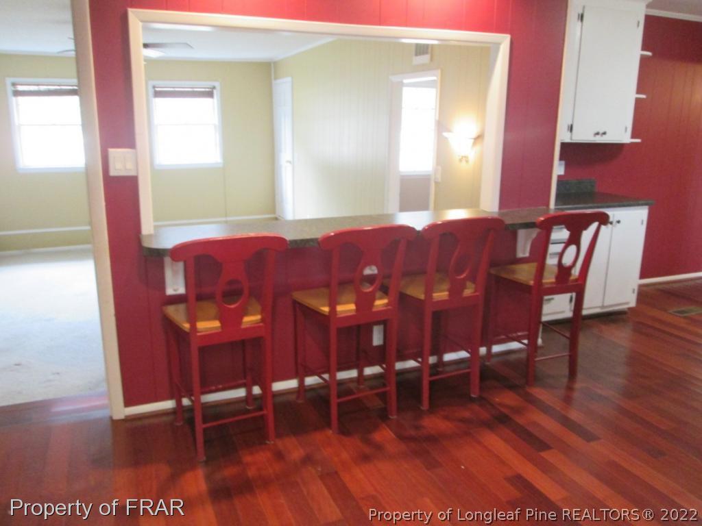 1817 Joel Road Carthage, NC 28327 - Photo 14 of 20 a view of a dining room with furniture and wooden floor