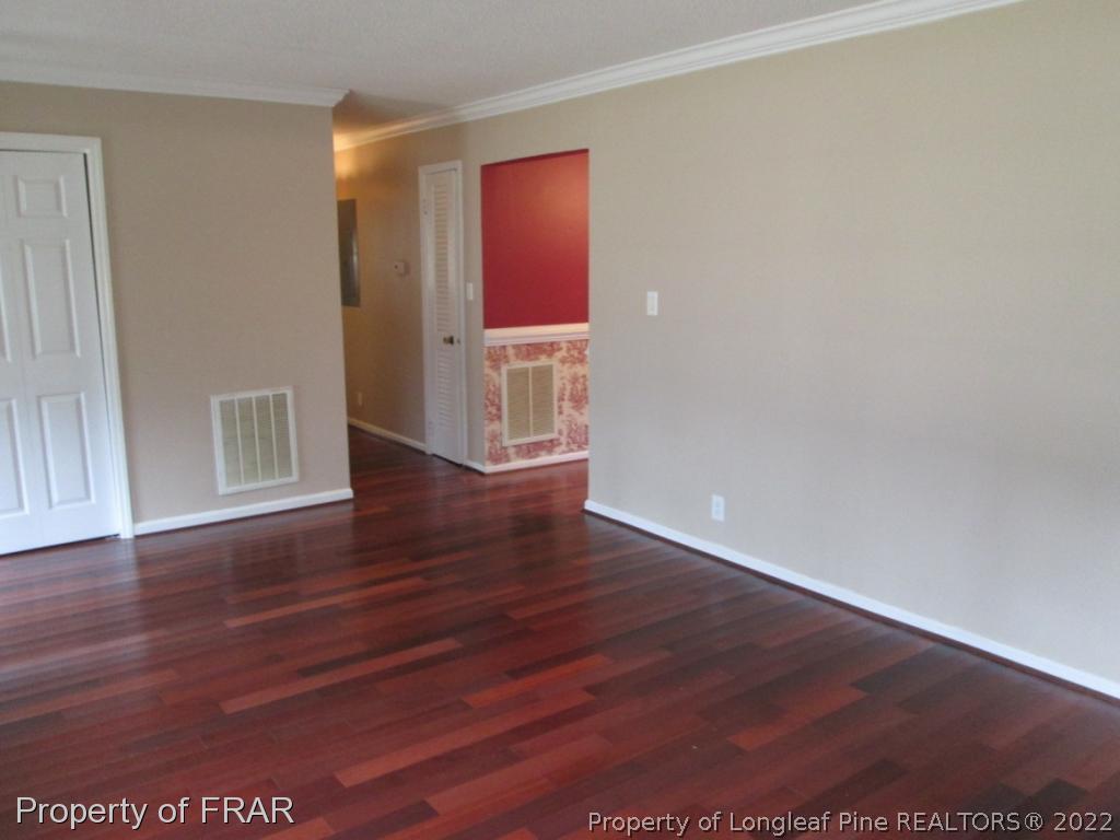 1817 Joel Road Carthage, NC 28327 - Photo 15 of 20 an empty room with wooden floor and closet