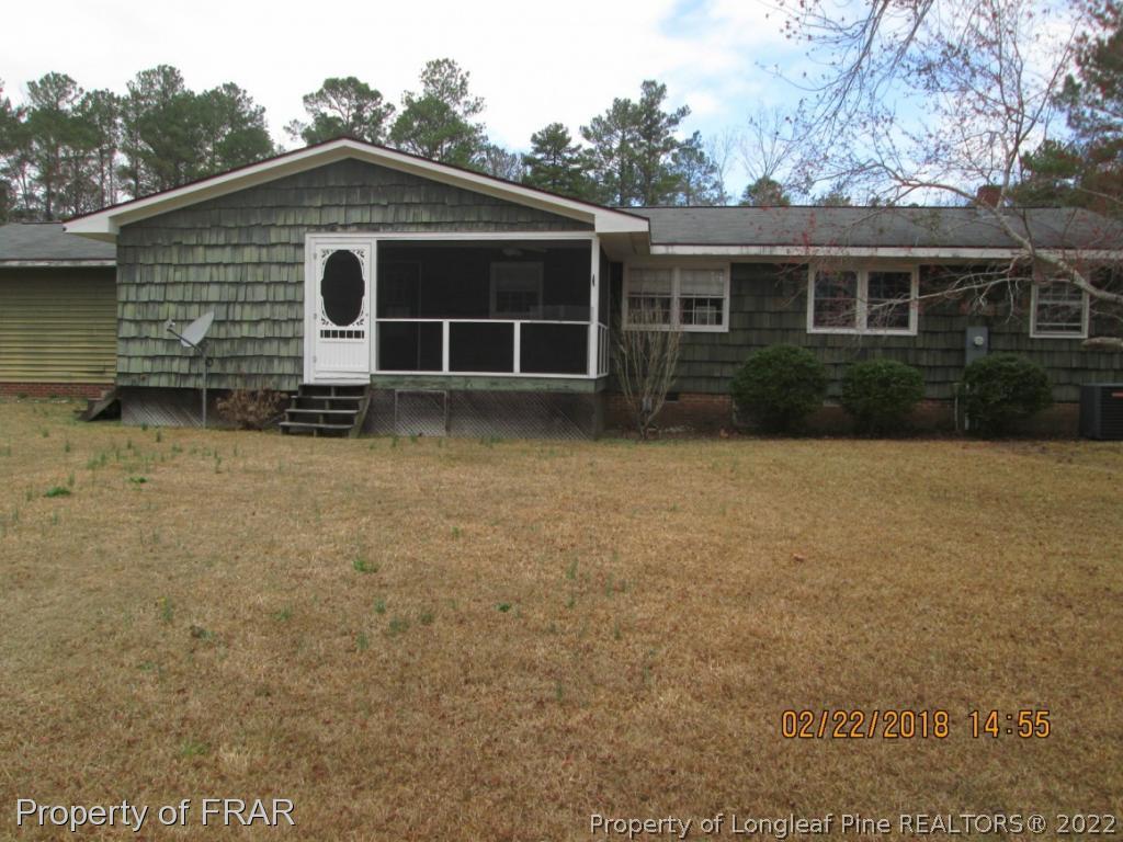 1817 Joel Road Carthage, NC 28327 - Photo 17 of 20 a front view of a house with a yard