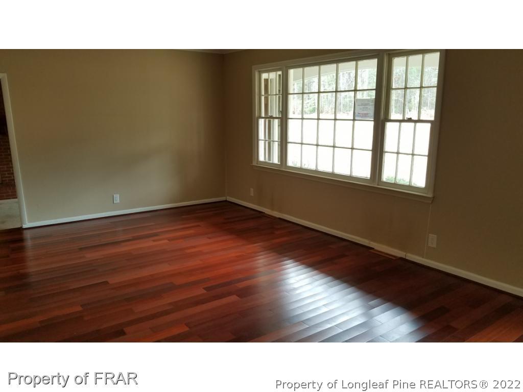 1817 Joel Road Carthage, NC 28327 - Photo 9 of 20 a room with wooden floor and windows
