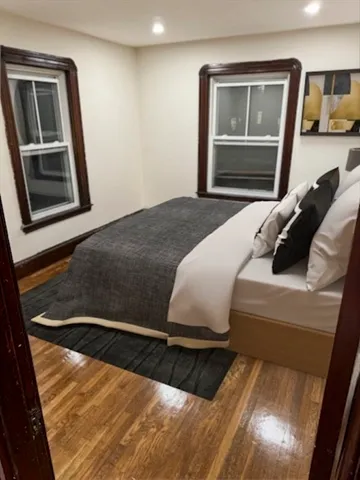 a bedroom with a bed and a dresser