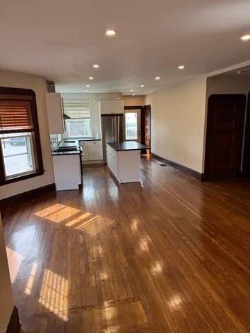 a view of a kitchen with a sink and a stove top oven