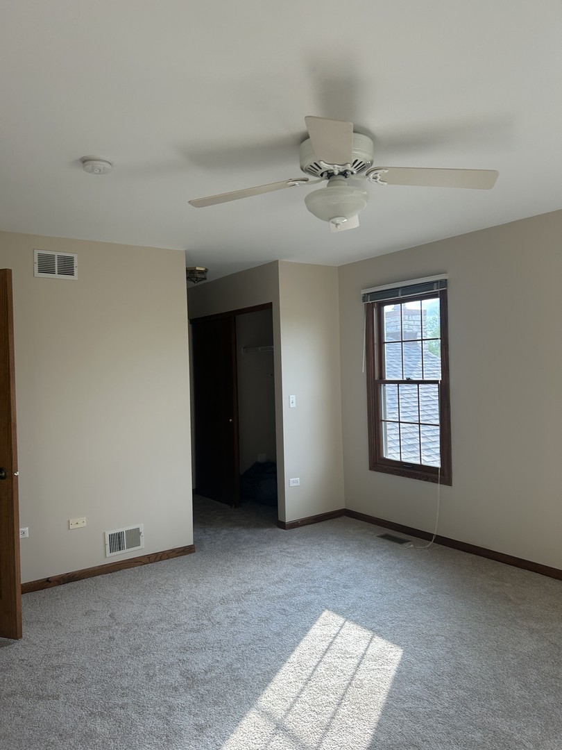 527 Springwood Lane Bolingbrook, IL 60440 - Photo 22 of 35 a view of an empty room with a window