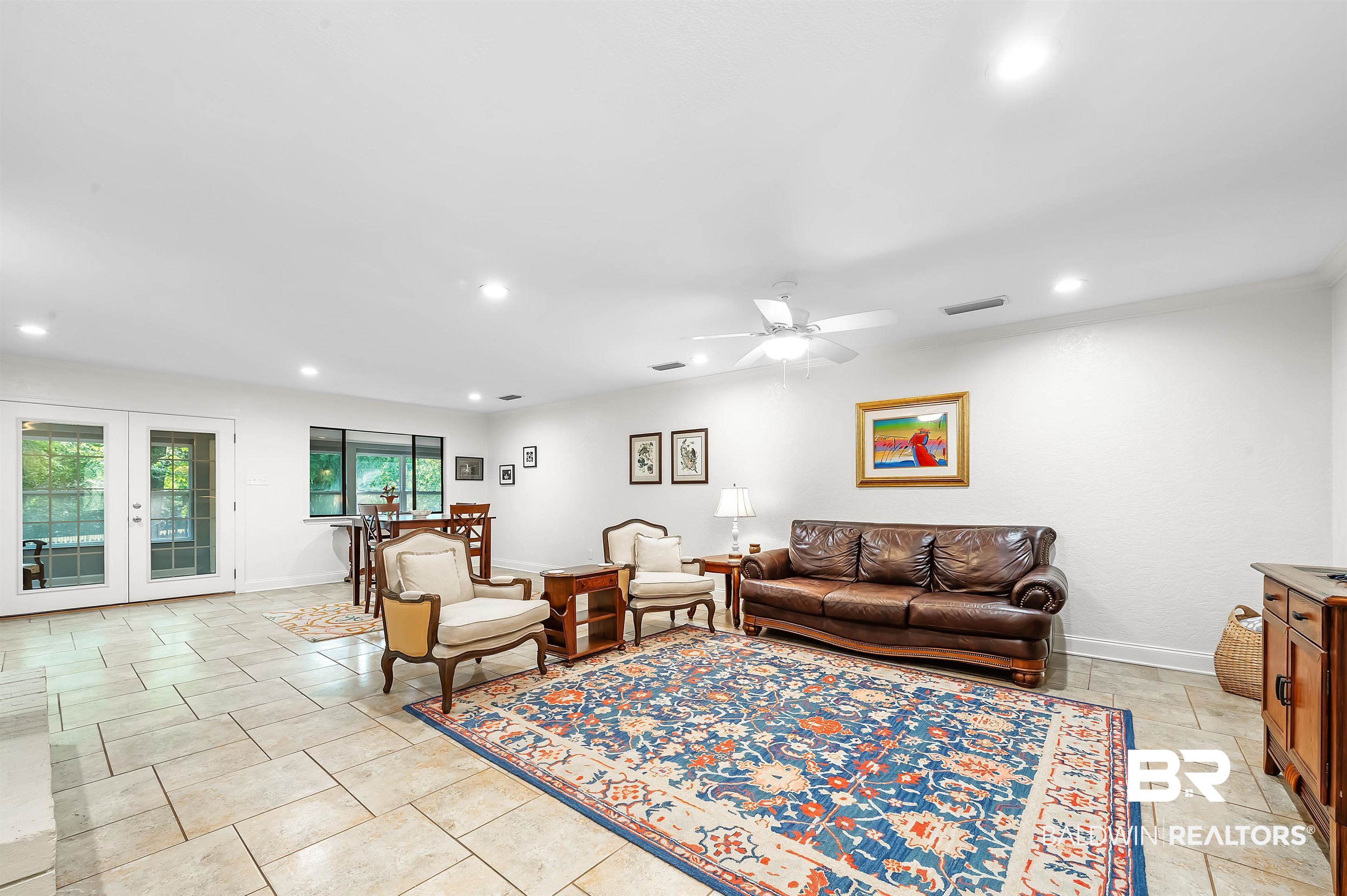 104 James Circle Daphne, AL 36526 - Photo 26 of 62 Tiled living room with french doors and ceiling fan