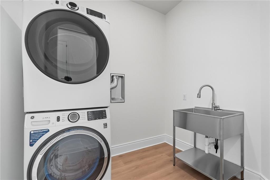 1 1st Street, Unit 407 Oakmont, PA 15139 - Photo 20 of 40 a close view of a utility room with dryer and washer