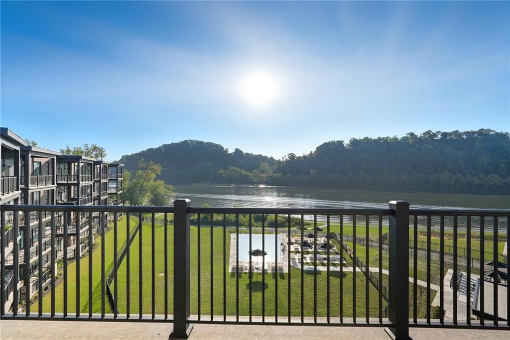 1 1st Street, Unit 407 Oakmont, PA 15139 - Photo 2 of 40 a view of swimming pool from a balcony