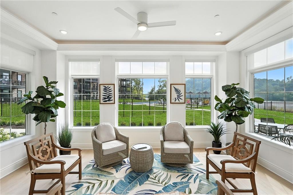 1 1st Street, Unit 407 Oakmont, PA 15139 - Photo 35 of 40 a living room with patio chairs and a large window