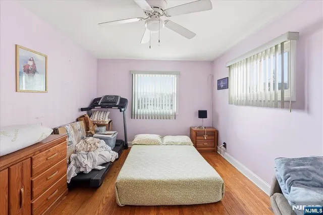 a bedroom with bed and window