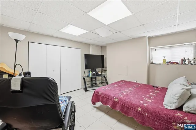 a bedroom with a bed and walk in closet