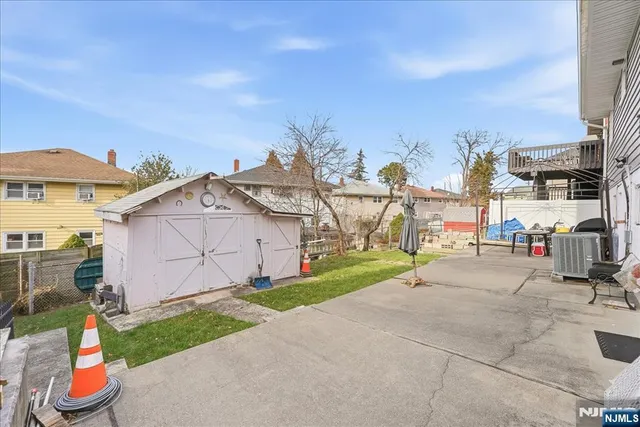 a view of a patio with a table and chairs