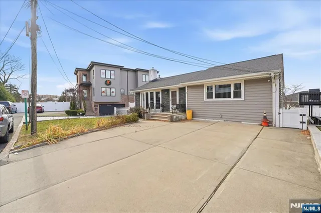 a view of a patio with couches table and chairs and potted plants