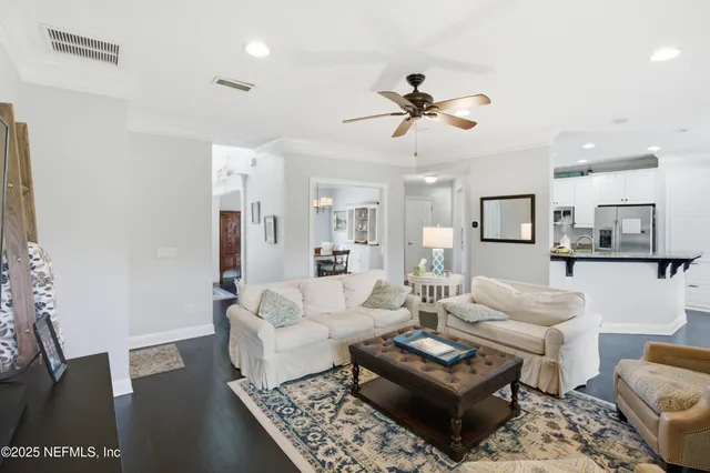 a bathroom with a sink a toilet and shower curtain