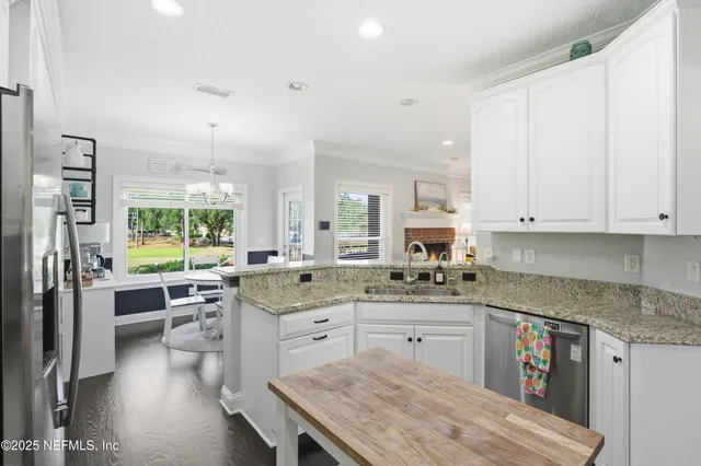 a bathroom with a sink a toilet and shower curtain