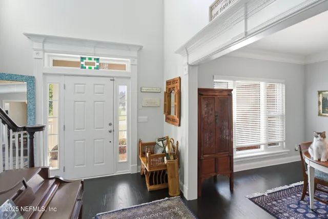 an aerial view of a house with a lake view