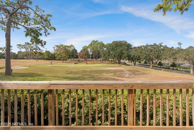 a bed room with a bed and a chandelier
