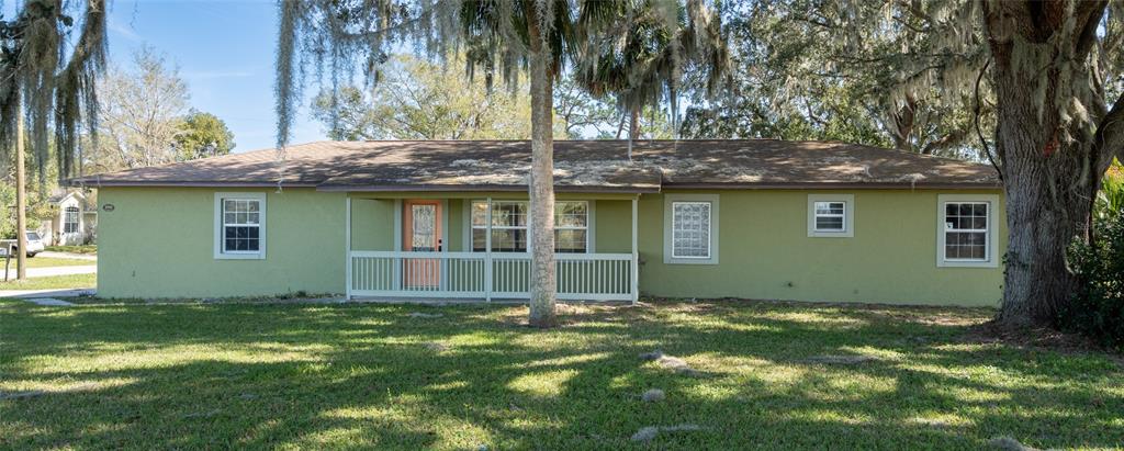 1505 Hontoon Road DeLand, FL 32720 - Photo 1 of 1 a house with a tree in front of it
