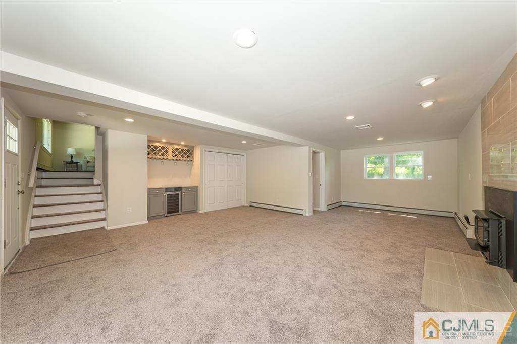 15 Scudder Road Ewing, NJ 08628 - Photo 4 of 25 a view of an empty room with a fireplace