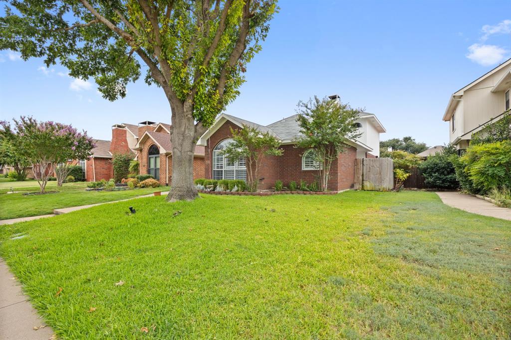 2016 Falcon Ridge Drive, Unit B Carrollton, TX 75010 - Photo 2 of 11 View of front facade featuring brick siding
