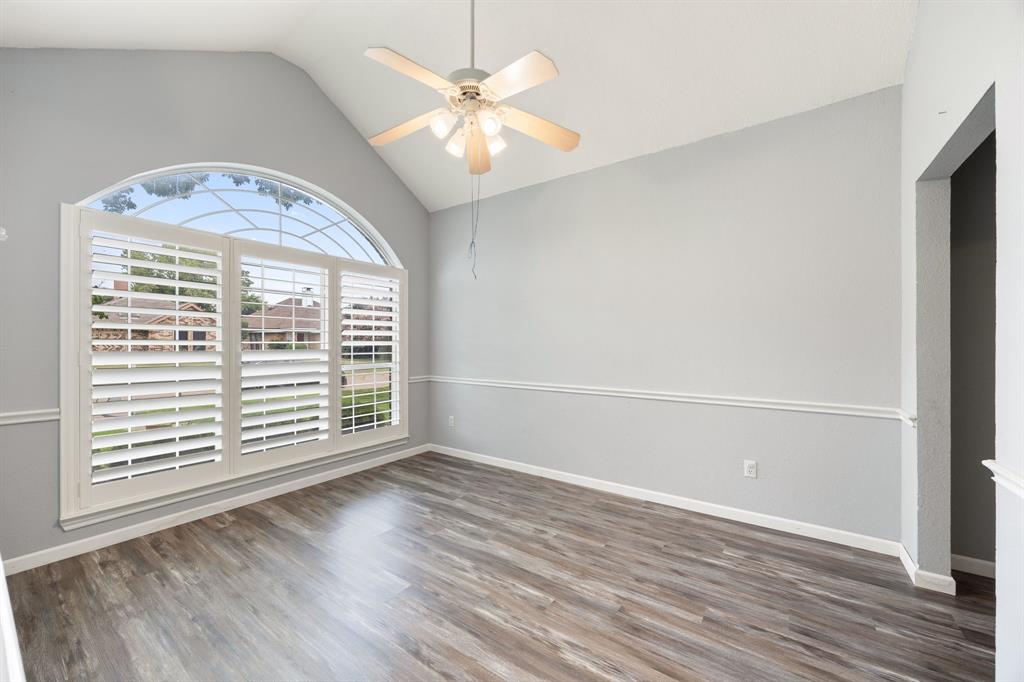 2016 Falcon Ridge Drive, Unit B Carrollton, TX 75010 - Photo 4 of 11 Unfurnished room with wood finished floors, ceiling fan, and high vaulted ceiling